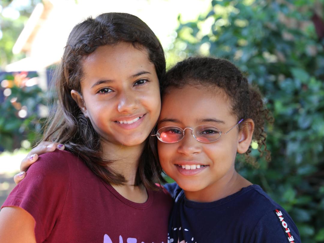Two girls from Brazil, one with GoodVision Glasses